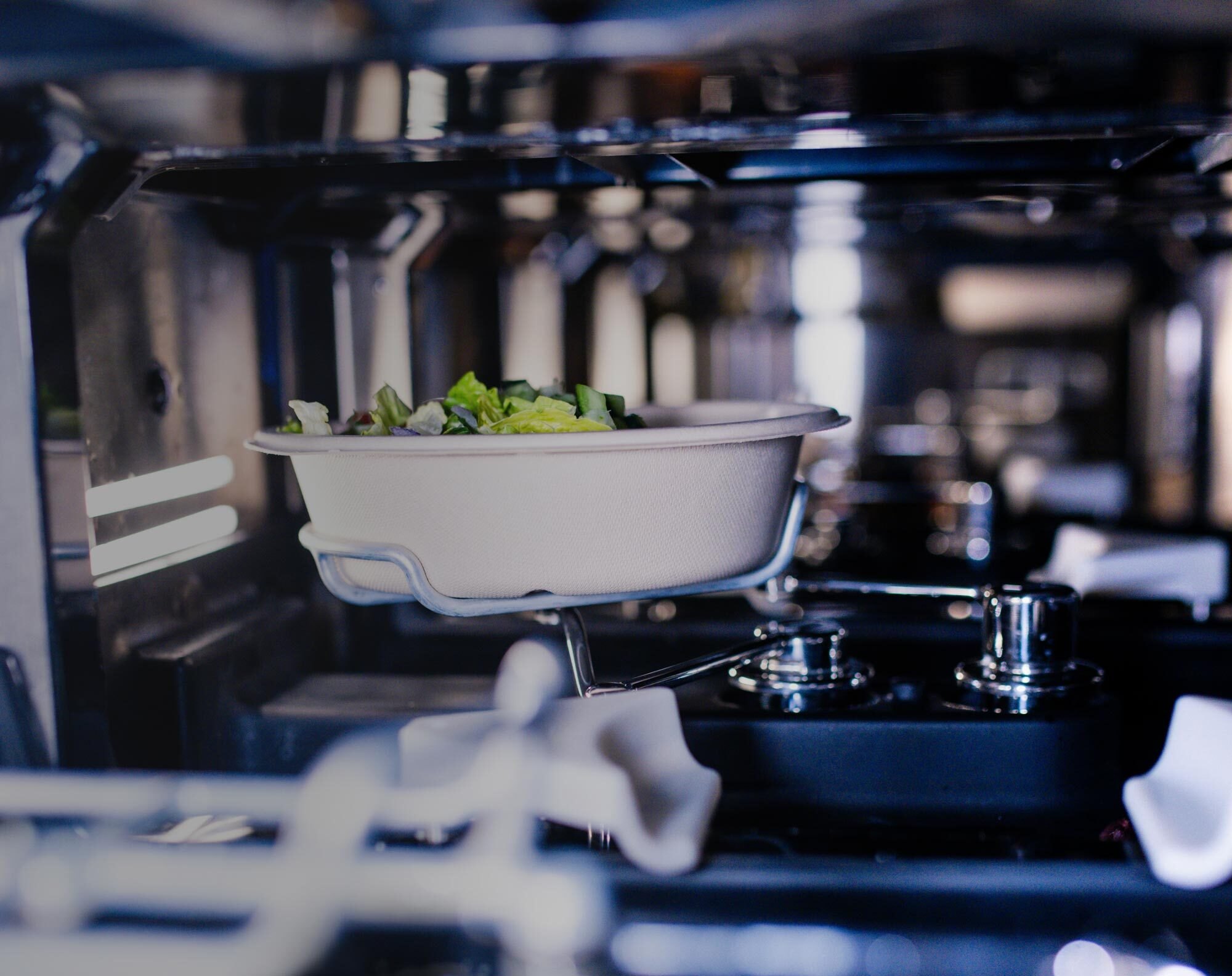 A finished bowl held by the Makeline inside the machine